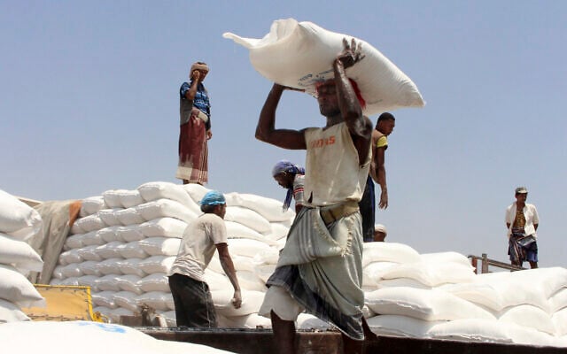 Men deliver UN World Food Program (WFP) aid in Aslam, Hajjah, Yemen, September 21, 2018. (Hammadi Issa/AP) Men deliver UN World Food Program (WFP) aid in Aslam, Hajjah, Yemen, September 21, 2018. (Hammadi Issa/AP)