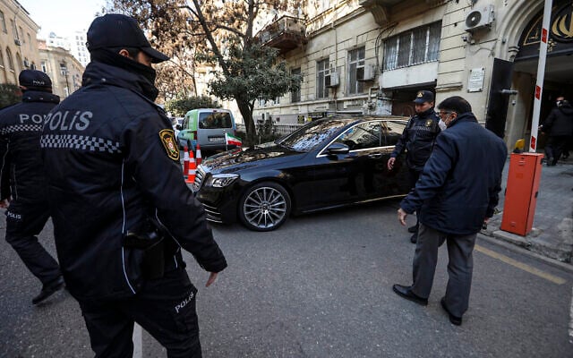 Police officers guard an area in front of the Iranian Embassy in Baku, Azerbaijan, Friday, Jan. 27, 2023.  (AP Photo/Aziz Karimov)
