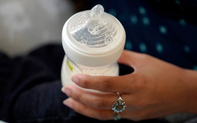 A woman holds a bottle of baby formula as she feeds her infant son in San Antonio on May 13, 2022. (AP Photo/Eric Gay) A woman holds a bottle of baby formula as she feeds her infant son in San Antonio on May 13, 2022. (AP Photo/Eric Gay)