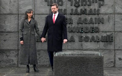 US Vice President JD Vance and second lady Usha Vance walk away after pausing a moment by the urn with the ashes of the unknown prisoner at the Dachau Concentration Camp Memorial Site outside Munich, Germany, February 13, 2025. (AP Photo/Matthias Schrader)