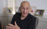 Former prime minister Ehud Olmert speaks during an interview with The Associated Press in his office in Tel Aviv on May 22, 2025. (Ariel Schalit/AP)