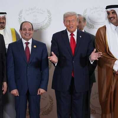 US President Donald Trump gestures during a photo during a summit to support ending the more than two-year Israel-Hamas war in Gaza after a breakthrough ceasefire deal, Monday, Oct. 13, 2025, in Sharm El Sheikh, Egypt, as Turkey's President Recep Tayyip Erdogan, Egypt's President Abdel-Fattah el-Sissi and Emir of Qatar Tamim bin Hamad Al Thani watch. In back are the Emir of Kuwait Sheikh Meshal Al Ahmad Al Sabah, Pakistan's Prime Minister Shehbaz Sharif and Netherland's Prime Minister Dick Schoof. (AP Photo/Evan Vucci, Pool) US President Donald Trump gestures during a photo during a summit to support ending the more than two-year Israel-Hamas war in Gaza after a breakthrough ceasefire deal, Monday, Oct. 13, 2025, in Sharm El Sheikh, Egypt, as Turkey's President Recep Tayyip Erdogan, Egypt's President Abdel-Fattah el-Sissi and Emir of Qatar Tamim bin Hamad Al Thani watch. In back are the Emir of Kuwait Sheikh Meshal Al Ahmad Al Sabah, Pakistan's Prime Minister Shehbaz Sharif and Netherland's Prime Minister Dick Schoof. (AP Photo/Evan Vucci, Pool)