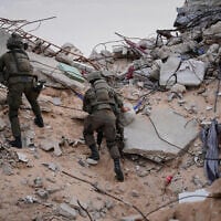 Illustrative: Israeli soldiers climb on the rubble next to the entrance of a tunnel in Rafah, Gaza Strip, December 8, 2025. (AP/Sam Mednick)