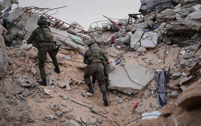 Illustrative: Israeli soldiers climb on the rubble next to the entrance of a tunnel in Rafah, Gaza Strip, December 8, 2025. (AP/Sam Mednick)