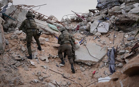 Illustrative: Israeli soldiers climb on the rubble next to the entrance of a tunnel in Rafah, Gaza Strip, December 8, 2025. (AP/Sam Mednick)