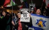 Illustrative: Members of the UK Jewish community hold placards mourning the victims of a shooting at Bondi Beach in Sydney during a Hanukkah celebration, in Trafalgar Square, London, December 16, 2025. (AP Photo/Kin Cheung)