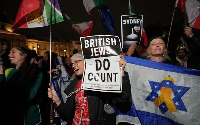 Illustrative: Members of the UK Jewish community hold placards mourning the victims of a shooting at Bondi Beach in Sydney during a Hanukkah celebration, in Trafalgar Square, London, December 16, 2025. (AP Photo/Kin Cheung) Illustrative: Members of the UK Jewish community hold placards mourning the victims of a shooting at Bondi Beach in Sydney during a Hanukkah celebration, in Trafalgar Square, London, December 16, 2025. (AP Photo/Kin Cheung)