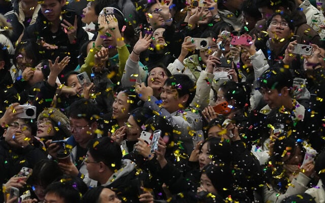 Revelers are showered by confetti as they celebrate the start of 2026 during the New Year's countdown event held at a shopping mall in Beijing, China, on January 1, 2026. (AP/Andy Wong) Revelers are showered by confetti as they celebrate the start of 2026 during the New Year's countdown event held at a shopping mall in Beijing, China, on January 1, 2026. (AP/Andy Wong)