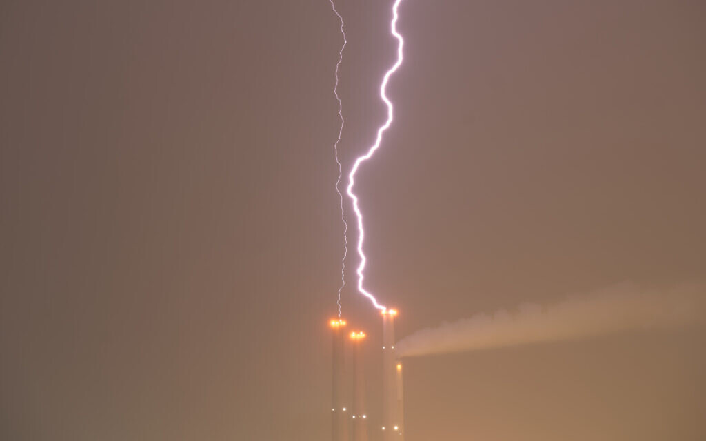 Lighting strikes Orot Rabin power plant near Hadera, January 1, 2026. (AP/Ariel Schalit) Lighting strikes Orot Rabin power plant near Hadera, January 1, 2026. (AP/Ariel Schalit)
