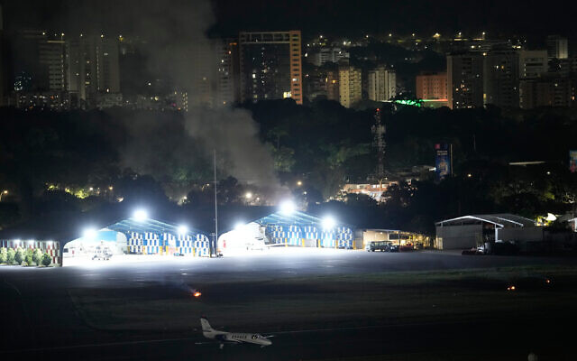 Smoke raises at La Carlota airport after explosions and low-flying aircraft were heard in Caracas, Venezuela, January 3, 2026. (AP Photo/Matias Delacroix) Smoke raises at La Carlota airport after explosions and low-flying aircraft were heard in Caracas, Venezuela, January 3, 2026. (AP Photo/Matias Delacroix)