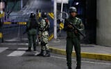 Soldiers guard the area around the Miraflores presidential palace after explosions and low-flying aircraft were heard in Caracas, Venezuela, January 3, 2026. (AP/Cristian Hernandez)