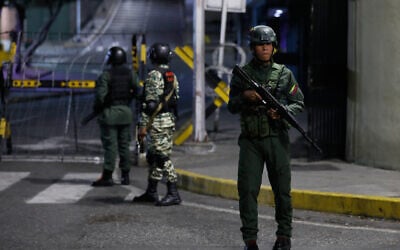 Soldiers guard the area around the Miraflores presidential palace after explosions and low-flying aircraft were heard in Caracas, Venezuela, January 3, 2026. (AP/Cristian Hernandez)