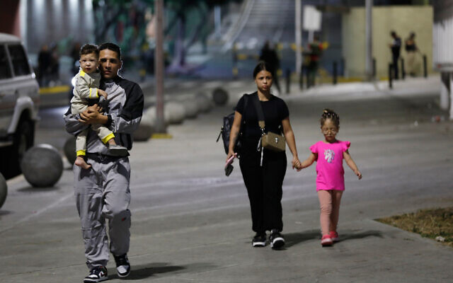 Pedestrians walk past the Miraflores presidential palace after explosions and low-flying aircraft were heard in Caracas, Venezuela, January 3, 2026. (AP Photo/Cristian Hernandez) Pedestrians walk past the Miraflores presidential palace after explosions and low-flying aircraft were heard in Caracas, Venezuela, January 3, 2026. (AP Photo/Cristian Hernandez)