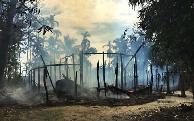 In this September 7, 2017, file photo, smoke rises from a burned house in Gawdu Zara village, northern Rakhine state, where the vast majority of Myanmar's 1.1 million Rohingya lived. (AP Photo, File) In this September 7, 2017, file photo, smoke rises from a burned house in Gawdu Zara village, northern Rakhine state, where the vast majority of Myanmar's 1.1 million Rohingya lived. (AP Photo, File)