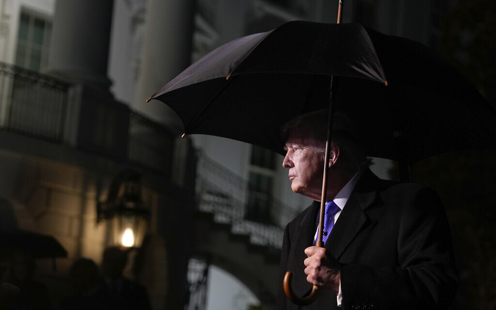 US President Donald Trump speaks with reporters before departing on Marine One from the South Lawn of the White House, January 9, 2026, in Washington. (AP Photo/Alex Brandon)