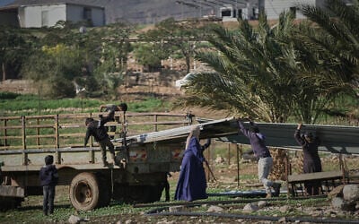 Palestinian residents of Ras Ein al-Auja village in the West Bank pack up their belongings and prepare to leave their homes after deciding to flee mounting settler violence, January 11, 2026. (AP/Mahmoud Illean) Palestinian residents of Ras Ein al-Auja village in the West Bank pack up their belongings and prepare to leave their homes after deciding to flee mounting settler violence, January 11, 2026. (AP/Mahmoud Illean)