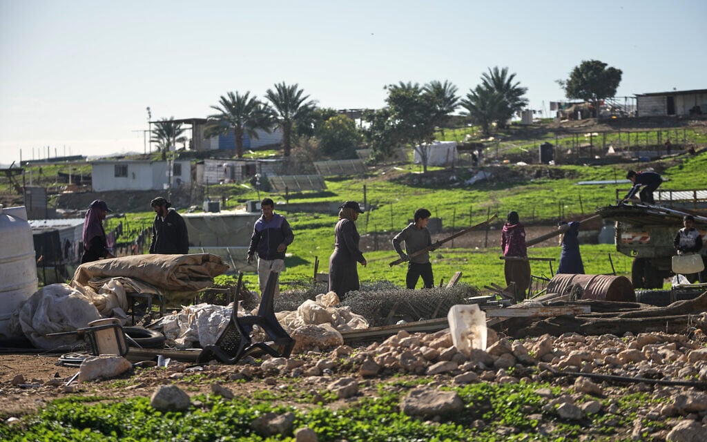 Palestinian residents of the West Bank's Ras Ein al-Auja village pack up their belongings and prepare to leave their homes after deciding to flee rising settler violence, January 11, 2026. (AP/Mahmoud Illean)