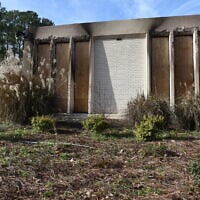 Boards cover the charred remains of the Beth Israel Congregation library, in Jackson, Mississippi, January 12, 2026. (AP Photo / Sophie Bates)