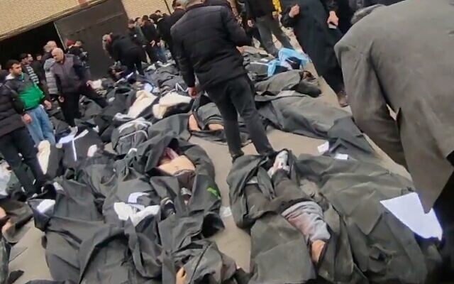This frame grab from videos taken between Jan. 9 and Jan. 11, 2026, and circulating on social media purportedly shows images from a morgue with dozens of bodies and mourners after crackdown on the outskirts of Iran's capital, in Kahrizak, Tehran Province. (UGC via AP) This frame grab from videos taken between Jan. 9 and Jan. 11, 2026, and circulating on social media purportedly shows images from a morgue with dozens of bodies and mourners after crackdown on the outskirts of Iran's capital, in Kahrizak, Tehran Province. (UGC via AP)