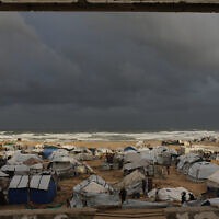 A view of a displacement camp sheltering Palestinians on a beach amid stormy weather in Gaza City, Tuesday, Jan. 13, 2026. (AP Photo/Jehad Alshrafi)