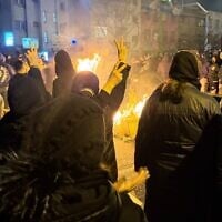 In this photo obtained by The Associated Press, Iranians attend an anti-government protest in Tehran, Iran, January 9, 2026. (UGC via AP)