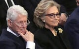 FILE - Former President Bill Clinton and former Secretary of State Hillary Clinton listen during the state funeral for former President Jimmy Carter at Washington National Cathedral in Washington, Jan. 9, 2025. (AP Photo/Jacquelyn Martin, File)