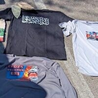 This photo provided by US Attorney's Office shows clothing displaying antisemitic, anti-Israel, and extremist symbols that were found in former Navy SEAL Seal  Gregory Vandenberg vehicle by authorities.  (US Attorney's Office via AP)