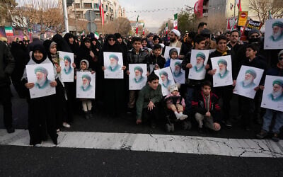 People hold posters of the Iranian Supreme Leader Ayatollah Ali Khamenei during a funeral ceremony for a group of security forces, who were killed during anti-government protests, in Tehran, Iran, January 14, 2026. (Vahid Salemi/AP) People hold posters of the Iranian Supreme Leader Ayatollah Ali Khamenei during a funeral ceremony for a group of security forces, who were killed during anti-government protests, in Tehran, Iran, January 14, 2026. (Vahid Salemi/AP)