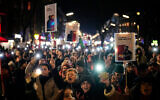 People take part in a rally in support of anti-government protests in Iran, in Berlin, Germany, January 14, 2026. (AP Photo/Ebrahim Noroozi)