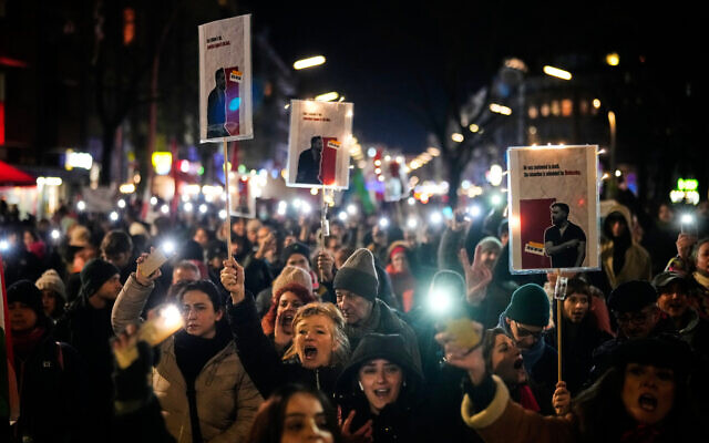 People take part in a rally in support of anti-government protests in Iran, in Berlin, Germany, January 14, 2026. (AP Photo/Ebrahim Noroozi) People take part in a rally in support of anti-government protests in Iran, in Berlin, Germany, January 14, 2026. (AP Photo/Ebrahim Noroozi)