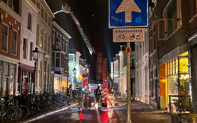 Firefighters work to extinguish the fire at the scene of an explosion in Utrecht, Netherlands, on January 15, 2026. (AP Photo/Ahmad Seir)