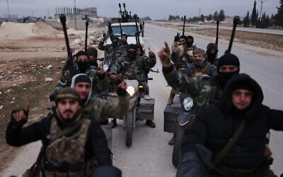 Syrian government soldiers carry machine guns as they ride motorcycles on a road leading to the town of Deir Hafer, Syria, January 17, 2026. (AP Photo/Ghaith Alsayed) Syrian government soldiers carry machine guns as they ride motorcycles on a road leading to the town of Deir Hafer, Syria, January 17, 2026. (AP Photo/Ghaith Alsayed)