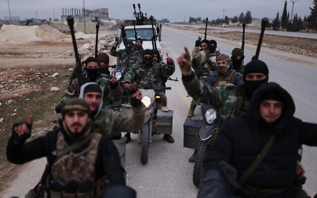 Syrian government soldiers carry machine guns as they ride motorcycles on a road leading to the town of Deir Hafer, Syria, January 17, 2026. (AP Photo/Ghaith Alsayed) Syrian government soldiers carry machine guns as they ride motorcycles on a road leading to the town of Deir Hafer, Syria, January 17, 2026. (AP Photo/Ghaith Alsayed)