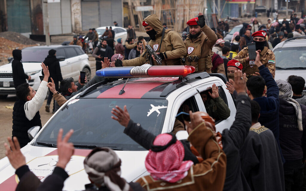 People welcome Syrian government forces as they enter the town of Maskana, January 17, 2026, following the withdrawal of the US-backed Syrian Democratic Forces. (AP Photo/Ghaith Alsayed)