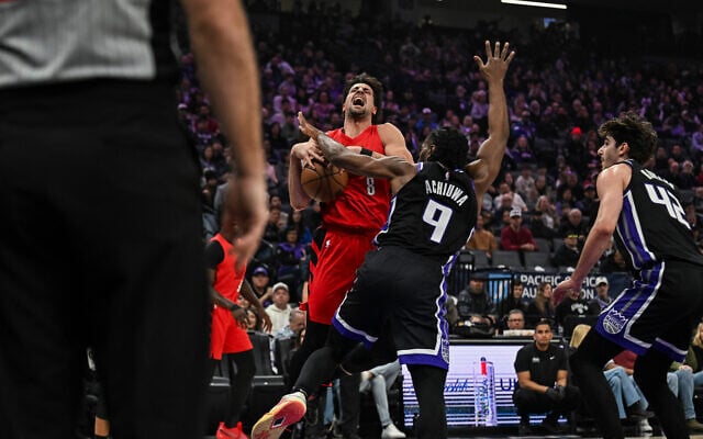 Portland Trail Blazers forward Deni Avdija (8) is fouled by Sacramento Kings forward Precious Achiuwa (9) during the first half of an NBA basketball game, January 18, 2026, in Sacramento, California. (AP Photo/Justine Willard) Portland Trail Blazers forward Deni Avdija (8) is fouled by Sacramento Kings forward Precious Achiuwa (9) during the first half of an NBA basketball game, January 18, 2026, in Sacramento, California. (AP Photo/Justine Willard)