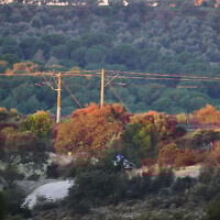 Police cars near the site of a high-speed train collision in Adamuz, near Córdoba, southern Spain, January 19, 2026. (AP Photo/Manu Fernandez)