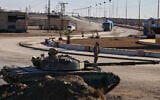 Syrian Democratic Forces (SDF) soldiers deploy with armored military vehicles to secure roads leading to Gweiran Prison which houses men accused of being an Islamic State (ISIS) fighters in Hassakeh, northeastern Syria, January 19, 2026. (AP Photo/Baderkhan Ahmad)
