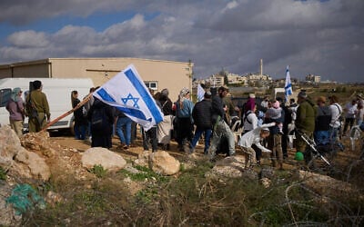 Settlers attend the inauguration ceremony of a newly legalized Jewish settlement, Yatziv, adjacent to the Palestinian city of Beit Sahour, in the West Bank, January 19, 2026. (Ohad Zwigenberg/AP)