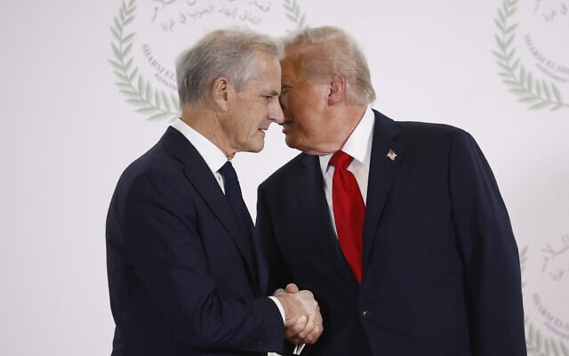 US President Donald Trump and Norway's Prime Minister Jonas Gahr Store shake hands during the group photo at the Gaza International Peace Summit in Sharm el-Sheikh, Egypt, October 13 2025. (Yoan Valat, Pool photo via AP) US President Donald Trump and Norway's Prime Minister Jonas Gahr Store shake hands during the group photo at the Gaza International Peace Summit in Sharm el-Sheikh, Egypt, October 13 2025. (Yoan Valat, Pool photo via AP)