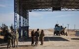 Syrian government troops are seen at an abandoned checkpoint between government-controlled Raqqa and Hassakeh, controlled by the Syrian Democratic Forces (SDF), in northeastern Syria, January 20, 2026. (AP Photo/Omar Albam)