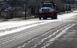 A Nashville Department of Transportation truck applies salt brine to a roadway Thursday, Jan. 22, 2026, in Nashville, Tenn. ahead of a winter storm expected to hit the state over the weekend. (AP Photo/George Walker IV)