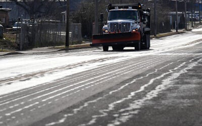 A Nashville Department of Transportation truck applies salt brine to a roadway Thursday, Jan. 22, 2026, in Nashville, Tenn. ahead of a winter storm expected to hit the state over the weekend. (AP Photo/George Walker IV)