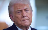 US President Donald Trump speaks with reporters aboard Air Force One after leaving the World Economic Forum in Davos, Switzerland, for Washington, January 22, 2026. (Evan Vucci/AP)