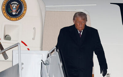 US President Donald Trump arrives on Air Force One at Joint Base Andrews, Maryland, January 22, 2026, after returning from the World Economic Forum in Davos.(Luis M. Alvarez/AP)