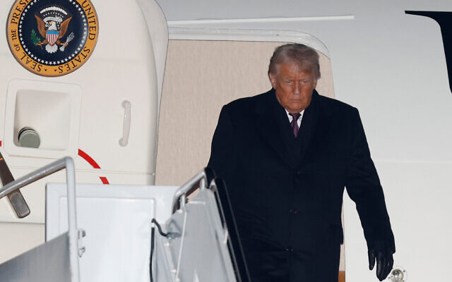 US President Donald Trump arrives on Air Force One at Joint Base Andrews, Maryland, January 22, 2026, after returning from the World Economic Forum in Davos.(Luis M. Alvarez/AP) US President Donald Trump arrives on Air Force One at Joint Base Andrews, Maryland, January 22, 2026, after returning from the World Economic Forum in Davos.(Luis M. Alvarez/AP)