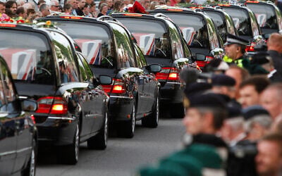 The coffins of seven British soldiers killed in Afghanistan, are driven through the town of Wootton Bassett, England, after repatriation to Britain, Tuesday, June 29, 2010. (AP Photo/Lefteris Pitarakis, file)