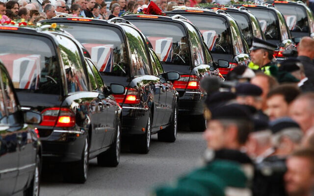 The coffins of seven British soldiers killed in Afghanistan, are driven through the town of Wootton Bassett, England, after repatriation to Britain, Tuesday, June 29, 2010. (AP Photo/Lefteris Pitarakis, file) The coffins of seven British soldiers killed in Afghanistan, are driven through the town of Wootton Bassett, England, after repatriation to Britain, Tuesday, June 29, 2010. (AP Photo/Lefteris Pitarakis, file)