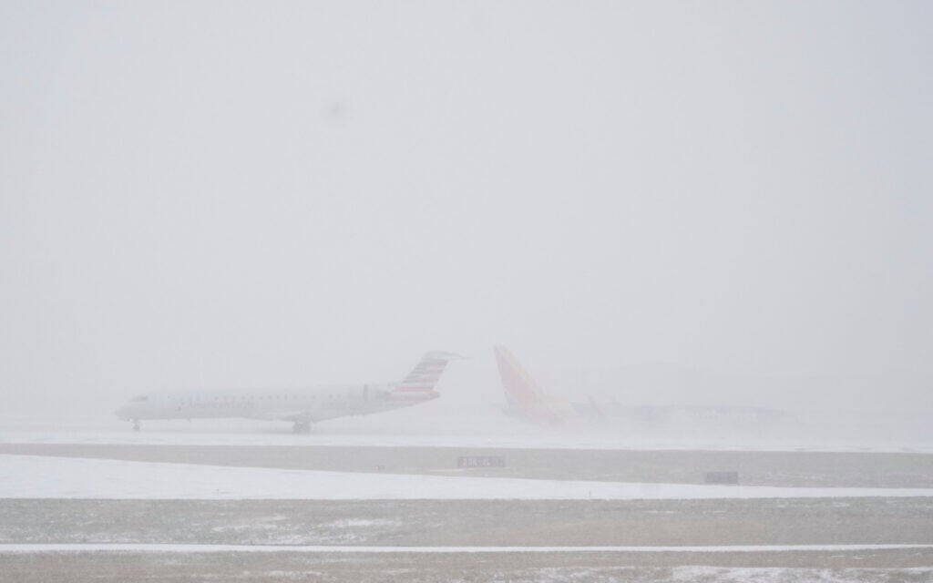 Brutal US travel day as more than 13,500 flights canceled amid massive winter storm