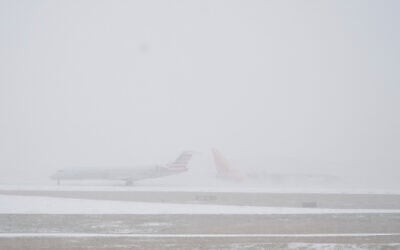 Planes move on the tarmac at the Nashville International Airport during a winter storm, January 24, 2026. (AP Photo/George Walker IV)