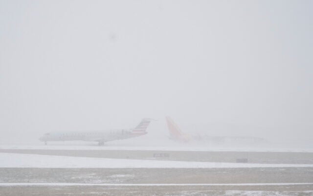 Planes move on the tarmac at the Nashville International Airport during a winter storm, January 24, 2026. (AP Photo/George Walker IV)